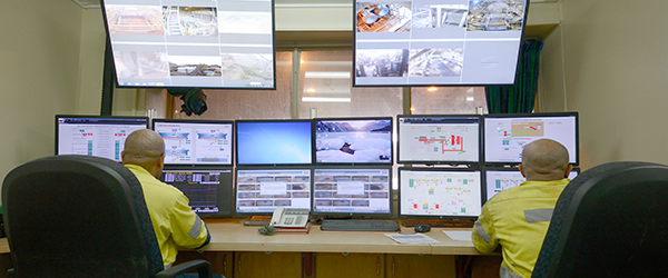 Operators in the Ok Tedi mine control room