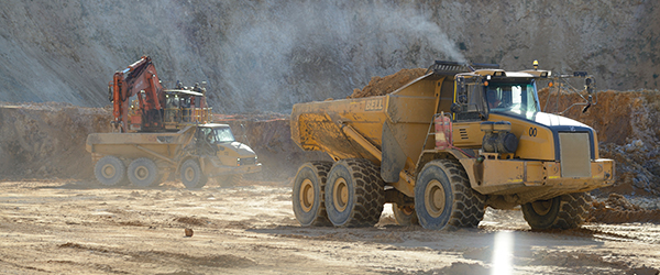 Haul trucks at the Simberi gold mine