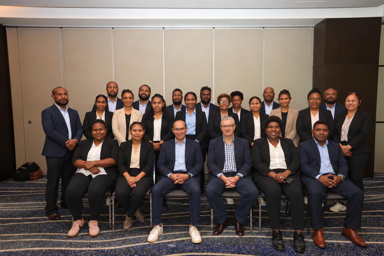 Conference participants posing together for a group photograph.